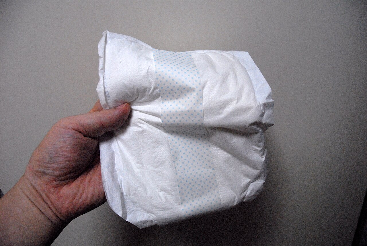 Incontinence pad for men holding penis sticking on briefs